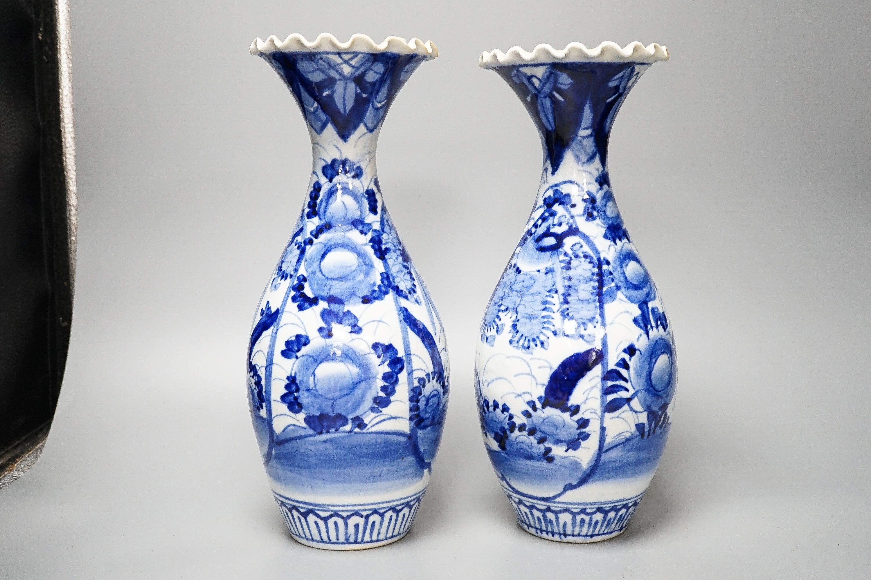 Two provincial Chinese blue and white jars and a pair of Japanese vases 32cm